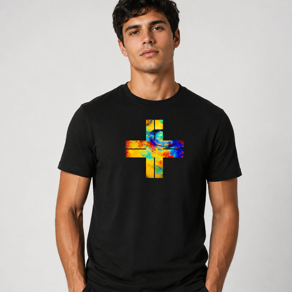 A man wearing a black crew-neck t-shirt with a colorful, abstract cross graphic on the chest, set against a plain light gray background.