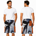 A male model shown from the front and back wearing a pair of cargo shorts with an abstract blue, gray, and black print and brown side pockets, styled with a white t-shirt and white sneakers against a plain white background.