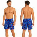 A male model shown from the front and back wearing blue swim trunks with a red and white abstract pattern, against a plain white background.