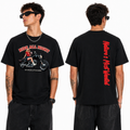 A man modeling a black graphic t-shirt from both the front and back views. The front features a red and white graphic of a woman on a motorcycle with the text 'RIDE ALL NIGHT' and 'NO RULES AFTER DARK'.